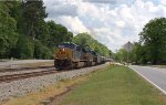 CSX 3045 and 986 lead a line of tank cars